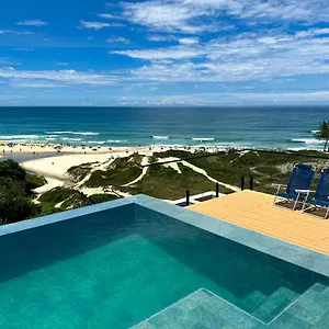 https://apartamentos-rosa-sul-pe-na-areia-praia-do-rosa.santa-catarina-brasil.com